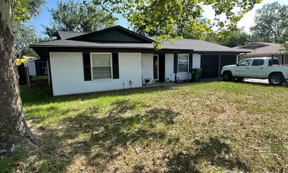 Professional roofing crew working on a residential roof in Raritan